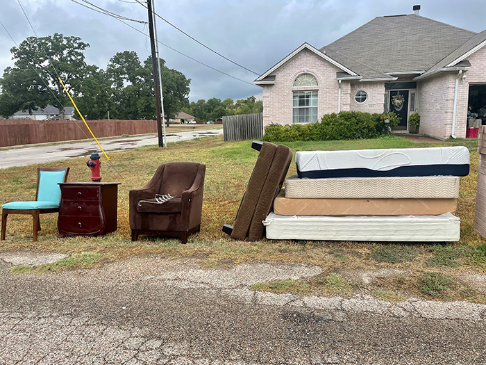 Junk removal crew clearing a Bryan, TX garage