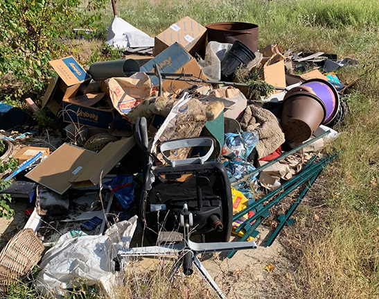 BCS Junk Removal crew loading furniture into a truck in Bryan, TX